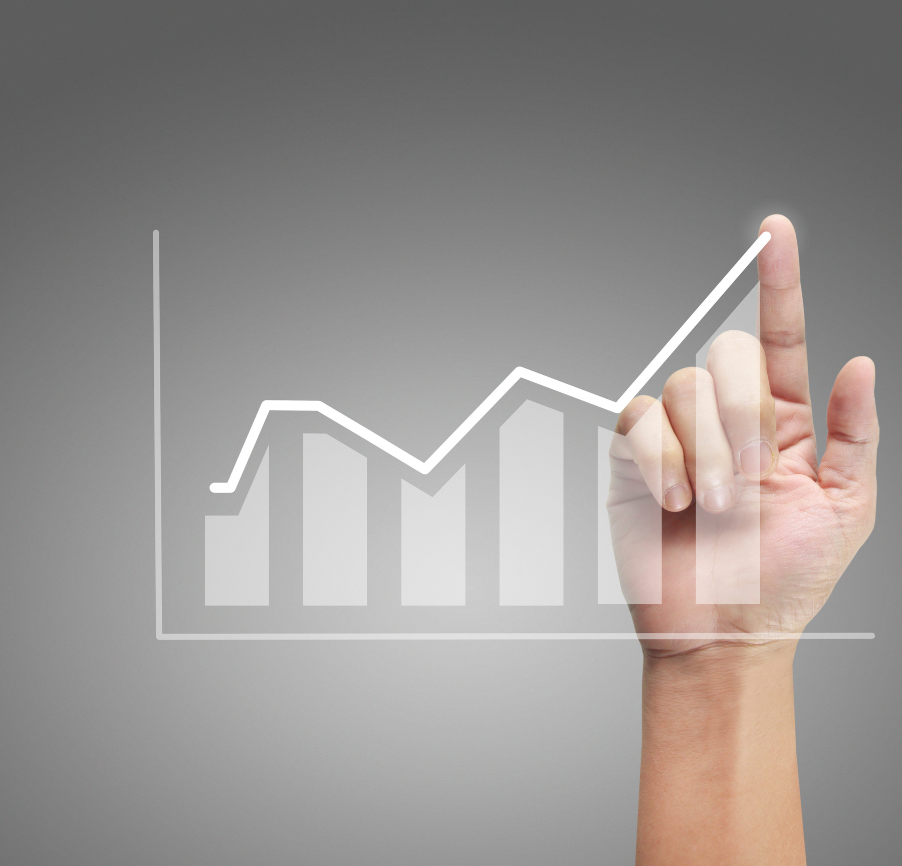 Hand touching graphs of financial indicator